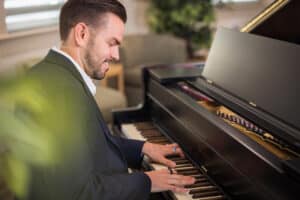Man playing piano for Western Slope residents