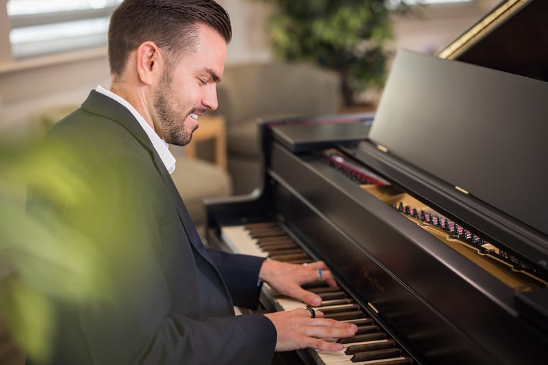 Man playing piano for Western Slope residents